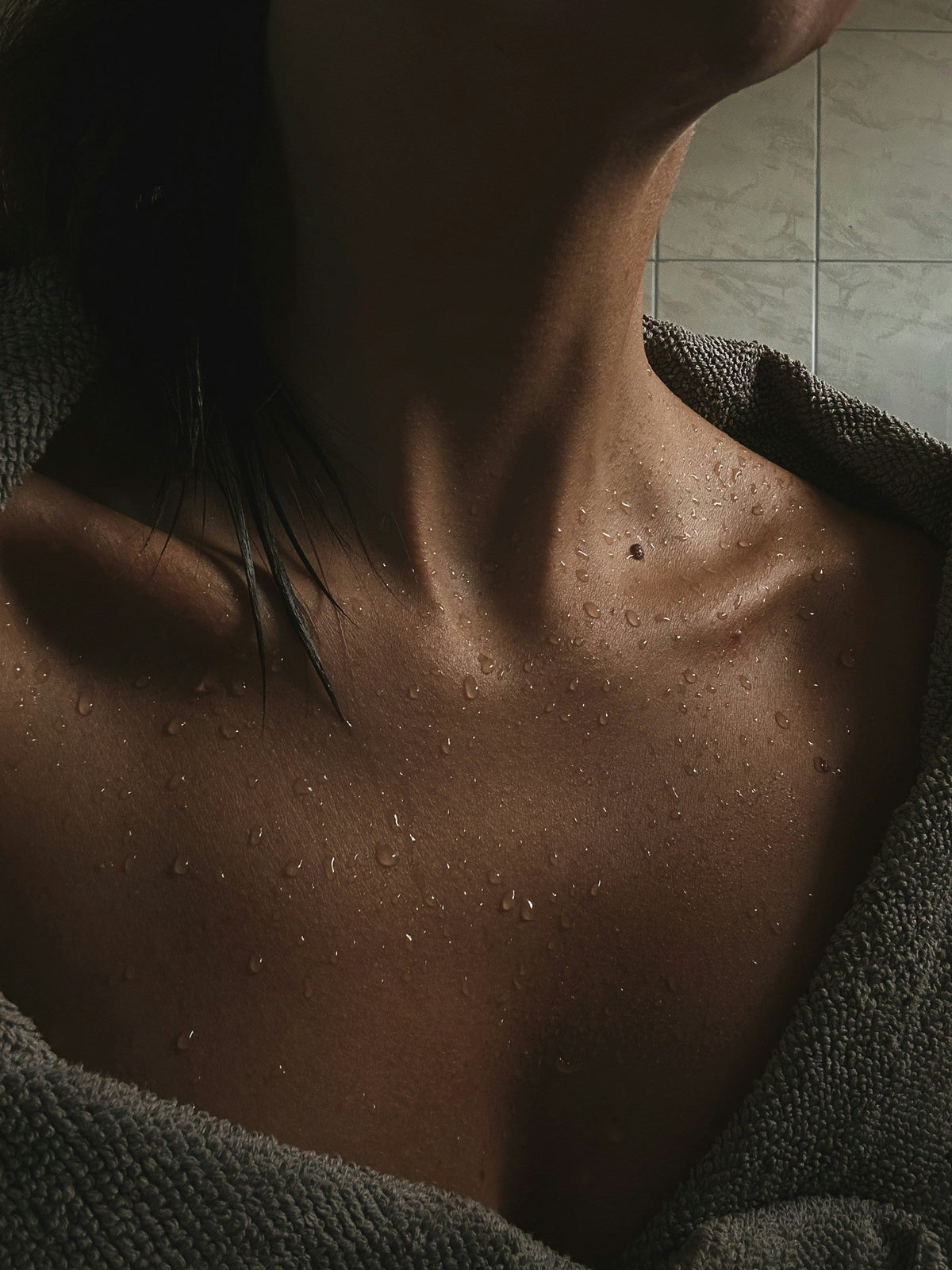 woman caring for dry skin after showering